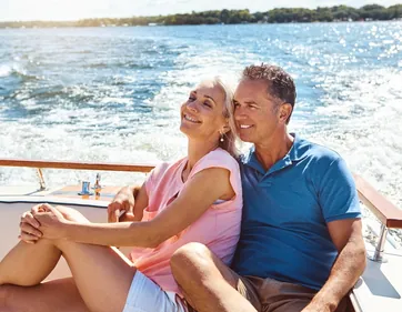 A couple relaxing together on a boat